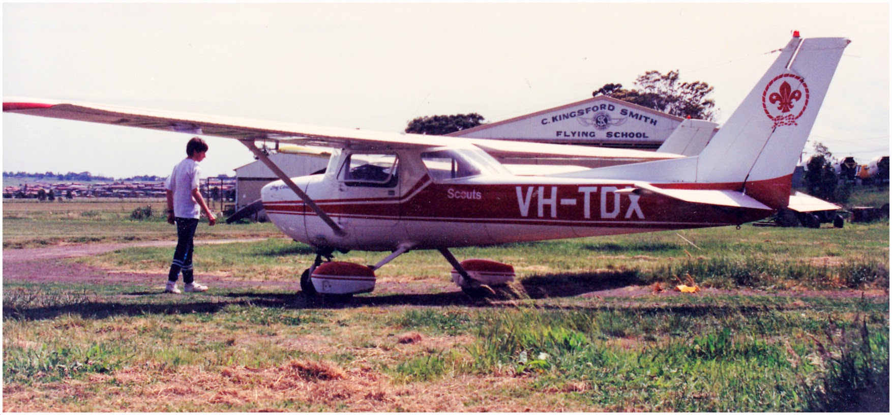A young Venturer Scout preflight training aircraft with Scout logo